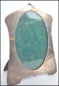 A silver hallmarked photograph frame in the Arts & Crafts manner by Deakin & Francis of Bimingham,