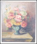 A 19th / 20th century oil on canvas still life study painting of a vase of chrysanthemums signed M
