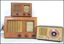 A collection of vintage radio's to include a bakelite black Philips, walnut valve radio with