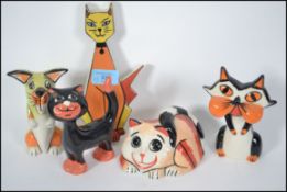 A group of Lorna Bailey ceramic cats all signed to include standing, seated, and a Purrdy wall