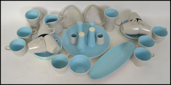 A retro mid century two tone vintage Poole Pottery part dinner and tea service being stamped to