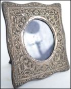 A Victorian silver hallmarked rococo photograph frame with easel back. Hallmarks not visible. Loss