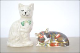 A Royal Crown Derby collectors guild exclusive catnip kitten paperweight with gold crown stopper