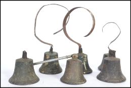 A group of six 19th century Victorian cast iron servants call bells having curved mounts.