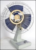 A vintage 1970's Ariel two tone desk top fan - mod