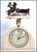 A vintage 20th century ashtray with mounted matador and bull figure to top raised on a circular