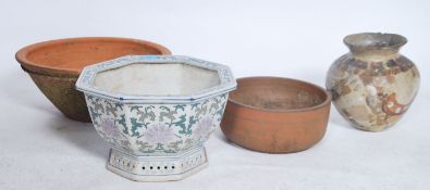 A group of 4 ceramic garden planters, one blue and white in Oriental form and the others of