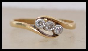An 18ct gold and diamond ring having three bezel s