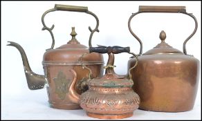 A 19th century Victorian large copper kettle by Edward Wilkes together with a smaller decorative