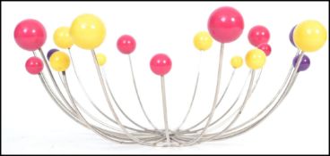 A 1970's  retro sputnik atomic fruit bowl having a chrome body with multi coloured ball end finials