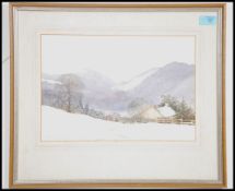 A framed and glazed watercolour scenic painting of a snow coloured landscape in the Lake District.