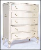 A Louis 16th style painted shabby chic bachelors chest of drawers having a bow front and raised on