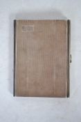 A silver hallmarked engine turned cigarette case, Birmingham assay marks, makers marks for Adie