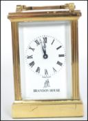 A vintage 20th century brass cased carriage clock having a Fema London 11 jewel movement with