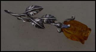 A fantastic sterling silver and amber style 925 stamped brooch in the form of a rose the stem of