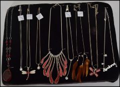 A good get group of 10 ladies necklaces to include silver and costume examples all mounted on a