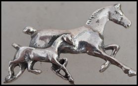 Hunting Interest. A silver 925 ladies horse brooch with horse and fowl. Pin to verso. Total weight