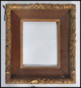 A good early 20th century heavy oak and gilt having gilt embellished floral heavy borders and gilt