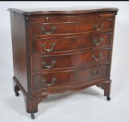 A mahogany serpentine fronted bachelors chest of drawers being raised on bracket feet having a