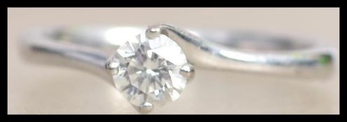 A hallmarked 18ct white gold and diamond single st