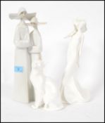 A LLadro Nun figurine group along with a Royal Doulton Images Of Nature cat figurine and a Royal