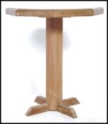 A 19th century style mahogany and walnut tripod wine table - lamp table being raised on column