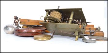 A good mixed lot to include a vintage clock movement, various tools, a telescopic drinking cup in