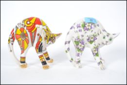 Two Paul Carter design cats from the Cool Catz collection, one entitled Art Deco the other Violet.