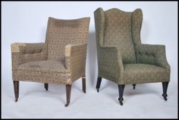 A Victorian wingback armchair being raised on turned legs with ceramic castors together with an