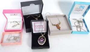 A collection of six boxed silver pendant necklaces to include amber, butterfly etc please see