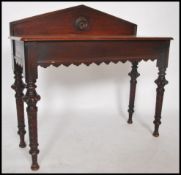 A Victorian mahogany writing table desk / console having spiral twist tapering legs with fitted