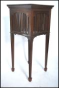 A Victorian Arts & Crafts mahogany plant stand in the manner of EW Godwin. Raised on squared legs
