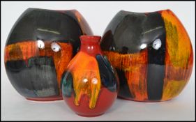 A group of retro 20th century Poole Gemstone pattern pottery to include a pair of moon vases and a