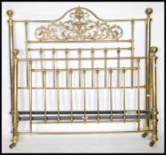 A Victorian style brass bed with tubular brass construction having ball finial tops ( see