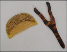 An Art Deco Japanese celluloid hair comb decorated with gilt overlay floral decoration together with
