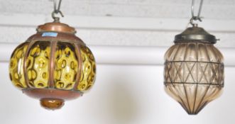 A matched pair of 20th century copper and coloured