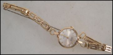 A 9ct gold Rotary 21 Jewel Incabloc ladies cocktail watch with 9ct bar link bracelet strap ( total