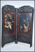 A large 19th century Japanese / Chinese lacquered chinoiserie two fold having carved hardwood
