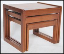 A 1970's retro teak wood Sunelm graduating nest of tables in the Danish manner. Each raised on