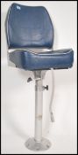 A 20th century swivel boat stool / chair. Having a vinyl covered seat pad raised on a chromed