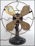 A vintage retro industrial factory mid century Italian made desk top fan. Metal blades behind wire