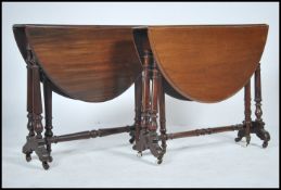 A Victorian mahogany sutherland occasional table being raised on turned legs together with another