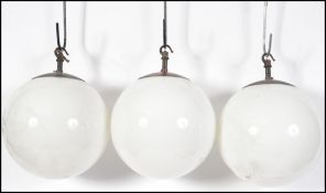 A set of 3 mid century milk glass globe lights - s