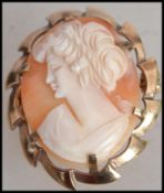 A 9ct gold hallmarked cameo brooch. The brooch with cameo of lady, pin verso with Birmingham