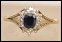 A hallmarked 9ct carat gold sapphire and diamond r