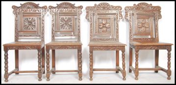 A set of 4 oak Wainscott style dining chairs being raised on turned legs united by peripheral