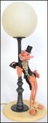 A fabulous Pink Panther retro table lamp in the form of a street lamp with the panther dressed as