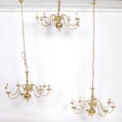 A set of 3 antique style brass chandeliers. Each with multiple sconces having ball finial column