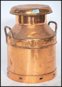 An early 20th century copper milk churn, stamped Express Dairy Ltd, London, further stamped to the