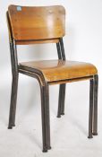 A pair of 1950's panel back tubular metal worked hall chairs raised on tubular metal frames with